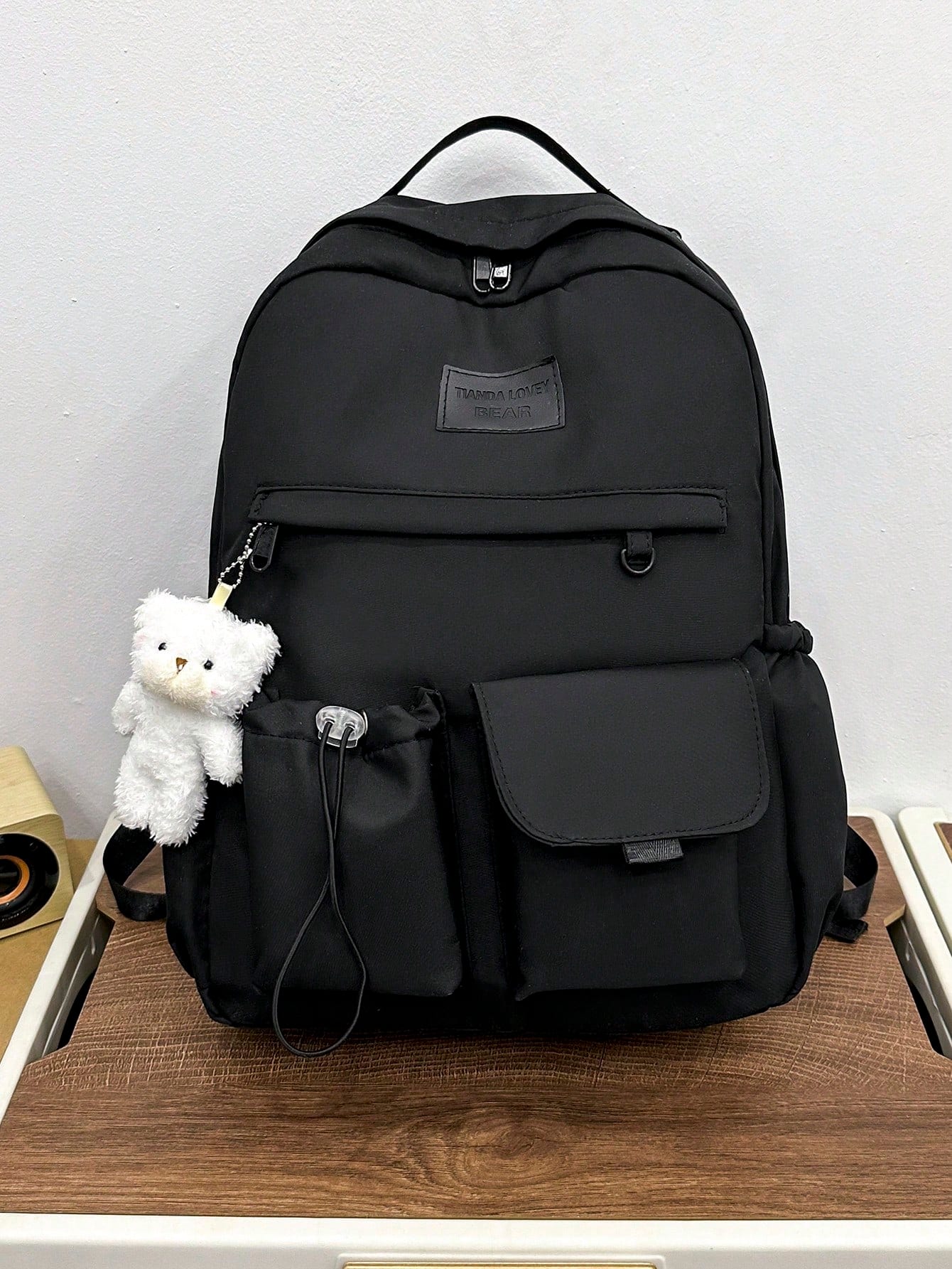 Sac à dos noir décontracté et de grande capacité avec pendentif ours. Convient pour un